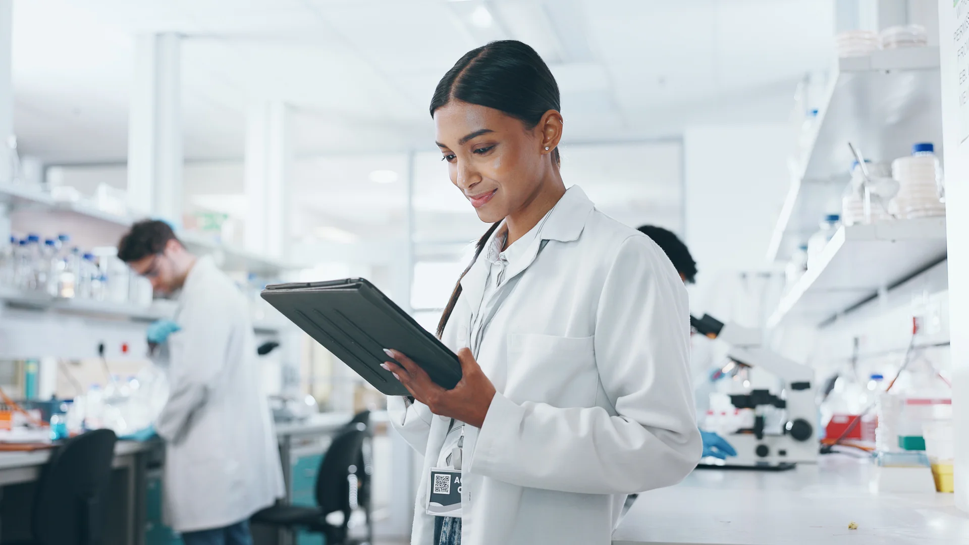 Pharmaceutical scientist conducting research and development in a modern laboratory environment.